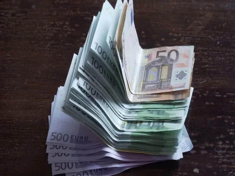 Putting a bundle of euros on the table Stock Footage 81027023