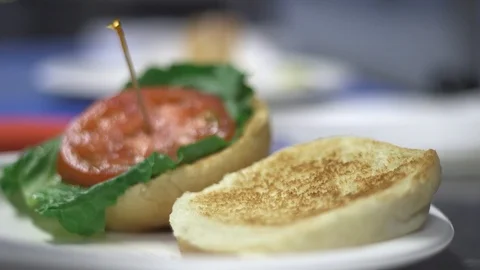 Putting a burger on a patty in a kitchen  Stock Footage 91360516