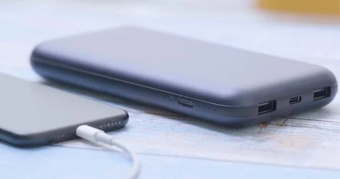 Putting cable into power bank. Closeup. Stock Footage 102723646