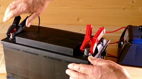 Putting car battery on charge. Stock Footage 66720187