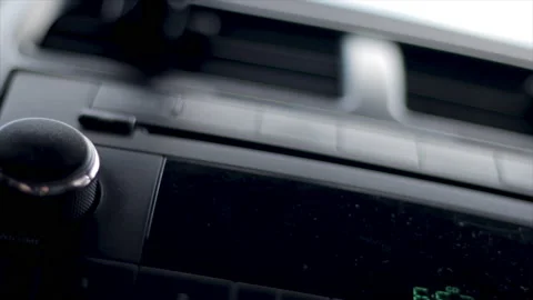 Putting CD in CD player close up. Playing music in car stereo system. Video stock 237729733