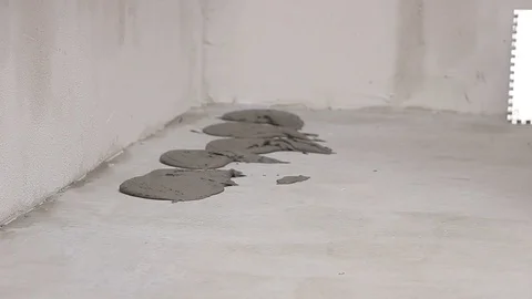 Putting cement adhesive on the floor Stock Footage 111866298