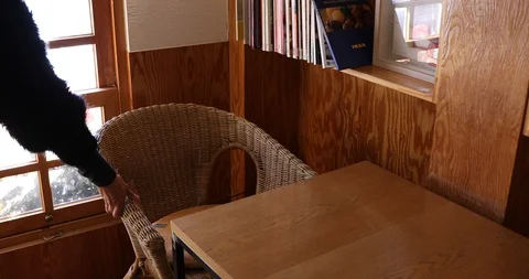 Putting chair by table to prepare for opening store Stock Footage 102355067