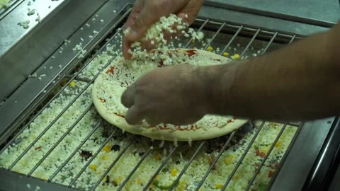 Putting cheese on pizza Stock Footage 187171489