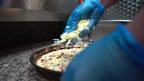 Putting Cheese On Pizza Slow Motion Stock Footage 146228434