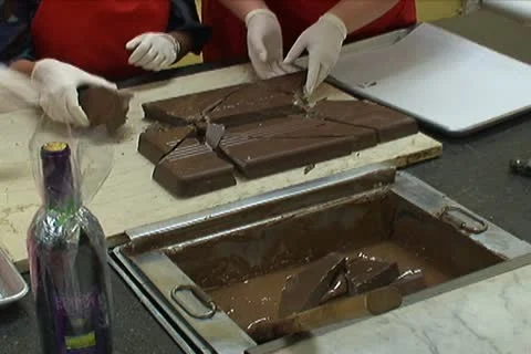 Putting Chocolate in Warmer to Melt 動画素材 10753218