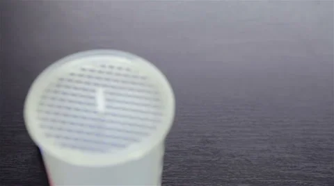 Putting  chocolate whey isolate protein into plastic white shaker Stock Footage 35587220