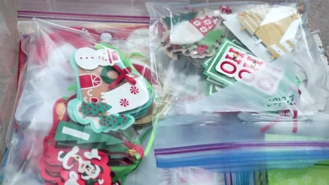 Putting Christmas Tags Back in Box Stock Footage 145035190