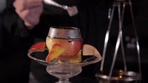 Putting coal in the bowl of a hookah Stock Footage
