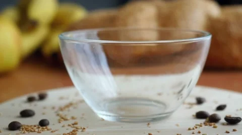 Putting the coffee beans in a transparent Coffee cup Stock-Footage 50068799