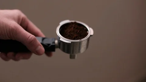 Putting coffee on a coffee machine Stock Footage 107416040
