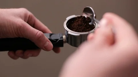 Putting coffee on a coffee machine Stock Footage 107434531