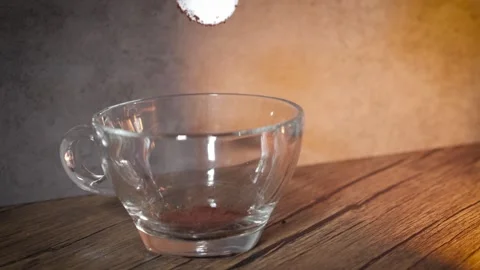 Putting coffee into the glass Stock Footage 243419938