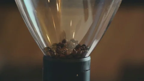 Putting coffee in grinder, slow motion Stock Footage 98709063
