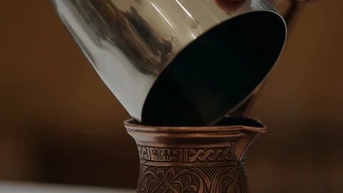 Putting coffee in kettle, 4k slow motion Stock Footage 98881610