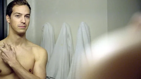 PUTTING ON COLOGNE Stock Footage 86127701