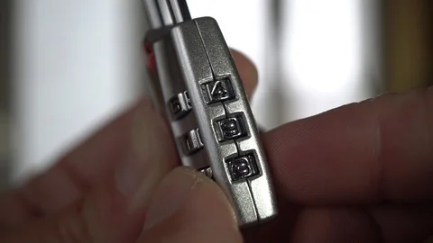 Putting the Combination of the Padlock, Slow Motion Video stock 120392238