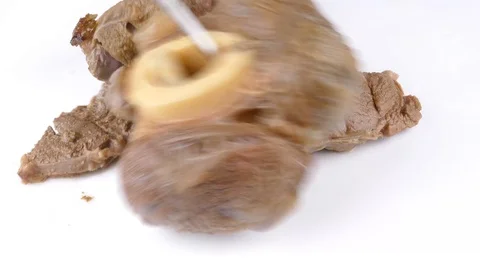 Putting cooked beef shanks on a white plate Stockbeeldmateriaal 119953899