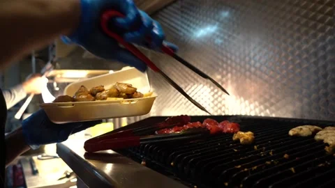 Putting Cooked Chicken Into Container Ready To Serve Stock Footage 146228456