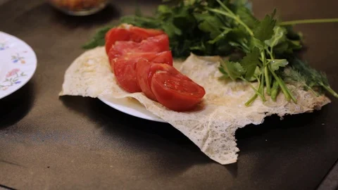 Putting cooked lule kebabs on a plate Video stock 103984948