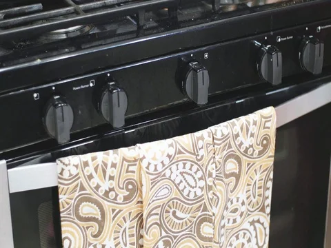 Putting cookies in the oven Stock Footage 80739981