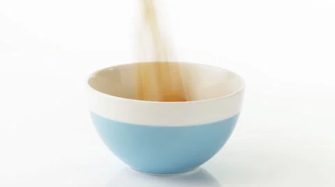 Putting cornflakes into a bowl Stock Footage 8571691