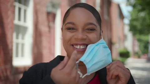 Putting On Covid Mask Smiling Stock Footage 133923973