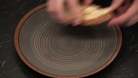 Putting cream cheese on bread above view Stock Footage 113528290