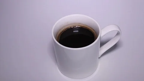 Putting A Cup Of Coffee On The Table Stock Footage 87502512