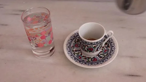 Putting A Cup of Turkish Coffee With Coffee Pot Stock Footage 136475080