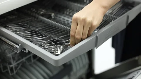 Putting cutlery in dish washer 스톡 동영상 270229111
