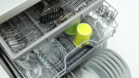 Putting cutlery in dish washer Stock Footage 270230029