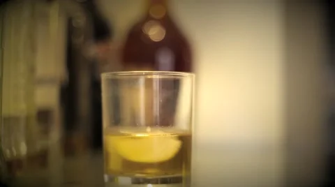 Putting Date rape drug in a drink Stock Footage 61380327