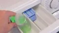 Putting detergent and softener in the washing machine HD Footage