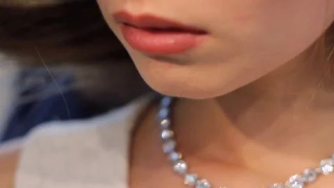 Putting on a Diamond Necklace Stock Footage 105263679