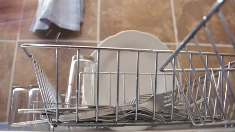 Putting Dishes On A Dish Rack Stock Footage 156765413