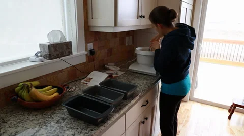 A putting dough in bread pans Stock Footage 35914704