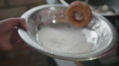 Putting doughnut in sugar Stock Footage 60689360