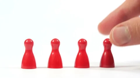 Putting down, placing a set of 4 simple red game pieces on a white background Stock Footage 171334907