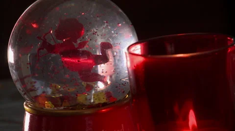 Putting Down a Valentines Themed Snow Globe Stock Footage 59345830