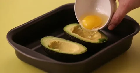 Putting eggs in the avocado 2 Video stock 132149586
