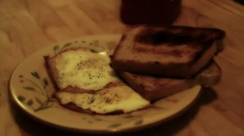 Putting eggs on toast Stock Footage 10996127