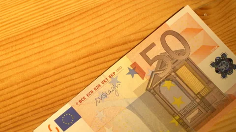 Putting euro bills Stock Footage 61439685