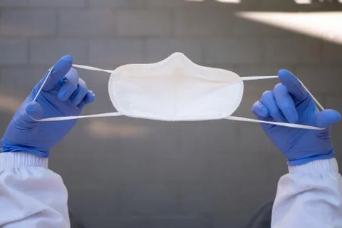 Putting FFP2 mask on Stock Photos