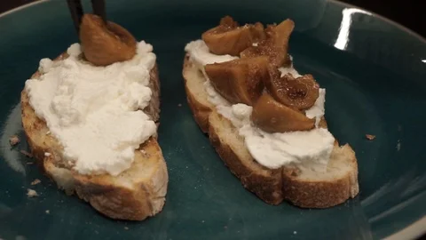 Putting figs on bread Stock Footage 113527528