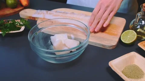 Putting the fish fillet pieces Stock-Footage 250134124
