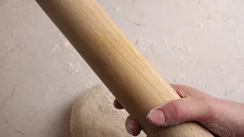 Putting the flour on the rolling pin Stock Footage 306194878