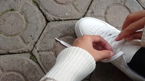 Putting a flower into a small vase Stock Footage 146254783