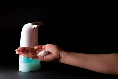 Putting foam soap on the hand Stock Photos