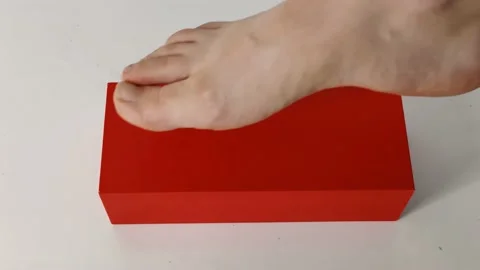 Putting foot on the red box Stock Footage